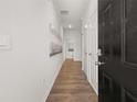 Bright hallway with hardwood floors and modern door at 2476 Bayberry St, Acworth, GA 30101