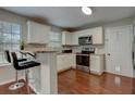 Kitchen with stainless steel appliances and granite countertops at 9265 Tara Sw Dr, Covington, GA 30014