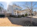 Two-story house with gray siding, and a side yard at 969 Rittenhouse Way, Atlanta, GA 30316