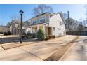 Two-story house with gray siding, driveway, and a landscaped yard at 969 Rittenhouse Way, Atlanta, GA 30316