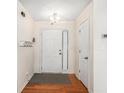 Bright entryway with hardwood floor and coat rack at 45 Kendall Ln, Covington, GA 30014