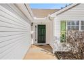 Green front door with sidelights and small porch at 45 Kendall Ln, Covington, GA 30014