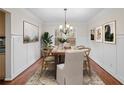 Elegant dining room with hardwood floors and wainscoting details at 1362 Meadow Creek Nw Way, Acworth, GA 30102