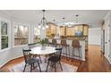 Eat-in kitchen offers a breakfast bar, pendant lighting, and large windows at 1362 Meadow Creek Nw Way, Acworth, GA 30102