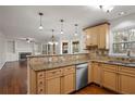 Kitchen features granite countertops, light wood cabinets, and stainless steel appliances at 1362 Meadow Creek Nw Way, Acworth, GA 30102