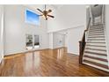 Spacious living room with hardwood floors, high ceilings, and a large window at 1362 Meadow Creek Nw Way, Acworth, GA 30102