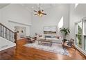 Bright living room boasts vaulted ceilings, hardwood floors, and large windows at 1362 Meadow Creek Nw Way, Acworth, GA 30102