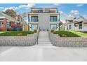 Contemporary home with a stairway and landscaped yard, showcasing a modern gray and white exterior design at 337 Pine Ne St # A, Atlanta, GA 30308