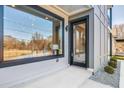 Modern front entrance with a glass door, large window, and stone accents at 337 Pine Ne St # A, Atlanta, GA 30308