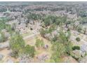 Aerial view showing home's location in a wooded suburban neighborhood at 3496 Wesley Chapel Rd, Decatur, GA 30034