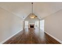 Spacious living room with hardwood floors and fireplace at 1708 Queen Victoria Ct, Locust Grove, GA 30248