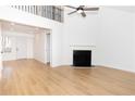 Bright living room featuring hardwood floors, a fireplace, and high ceilings at 3271 Deer Pause Ln, Decatur, GA 30034