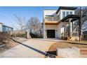 Two story home with modern farmhouse exterior, balcony, and attached garage at 862 Hobson Sw St, Atlanta, GA 30310