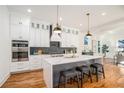 Modern kitchen with white cabinets, quartz countertops, and stainless steel appliances at 862 Hobson Sw St, Atlanta, GA 30310