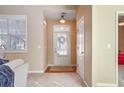 Bright and airy entryway with neutral walls and hardwood flooring at 340 Glens Way, Woodstock, GA 30188