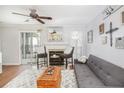 Cozy living room featuring a fireplace, hardwood floors and comfy seating at 631 Granville Ct, Atlanta, GA 30328