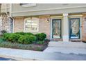 Townhome entrance with brick and stone accents at 6900 Roswell Rd, Atlanta, GA 30328