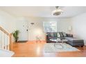 Bright living room with hardwood floors and sectional sofa at 6900 Roswell Rd, Atlanta, GA 30328