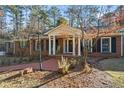 Brick ranch home with columns, walkway and landscaping at 200 Mcguirts Bridge Rd, Covington, GA 30014