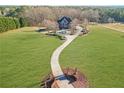 House with long driveway and large lawn at 1586 Highway 11 N, Social Circle, GA 30025