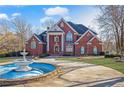 Two-story home with fountain and landscaping at 1586 Highway 11 N, Social Circle, GA 30025