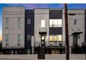 Contemporary townhome with gray and white exterior, front deck, and steps at 687 Banton Nw Dr, Atlanta, GA 30318