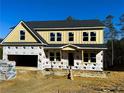 New construction home with yellow siding, a gray roof and a two-car garage at 161 Silvercrest Dr, Acworth, GA 30101