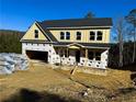 New construction home with yellow siding, a gray roof and a two-car garage at 161 Silvercrest Dr, Acworth, GA 30101