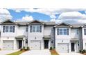 Modern townhomes with attached garages and attractive exterior finishes at 2098 Moss Hill Rd, Stone Mountain, GA 30088