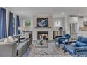 Cozy living room features a fireplace, lots of natural light and stylish furnishings at 3812 Thatcher Sw Dr, Marietta, GA 30008
