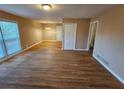 Hardwood floor living room with access to kitchen and other rooms at 1613 Gilston Ct, Decatur, GA 30032