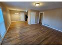 Hardwood floor living room with access to kitchen and other rooms at 1613 Gilston Ct, Decatur, GA 30032
