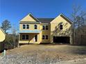 Two-story yellow house with a covered porch and attached garage at 171 Silvercrest Dr, Acworth, GA 30101