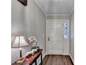 Bright entryway with hardwood floors and a white door at 208 Hickory Rdg, Cumming, GA 30040