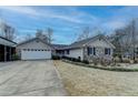 House exterior showcasing stone facade and landscaping at 208 Hickory Rdg, Cumming, GA 30040