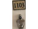 Apartment unit door with number 1103, peephole and door knocker at 2479 Peachtree Ne Rd # 1103, Atlanta, GA 30305