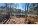 Backyard with a wooden deck overlooking a pond at 5674 Wylmoor, Norcross, GA 30093