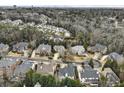 A panoramic view showcases a suburban neighborhood nestled among lush trees and mature landscaping at 745 Glengate Pl, Atlanta, GA 30328