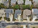 An aerial view shows an upscale neighborhood with well-maintained homes, landscaping and street layout at 745 Glengate Pl, Atlanta, GA 30328