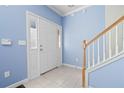 Light blue entryway with tiled floor and staircase at 2116 Del Lago Nw Cir # 3, Kennesaw, GA 30152