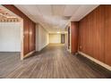 Unfinished basement with wood paneling and flooring at 272 Mckenzie Dr, Stockbridge, GA 30281