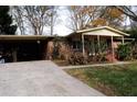 Brick ranch house with attached carport and landscaping at 2499 Little John Se Trl, Marietta, GA 30067