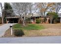 Ranch house with carport and landscaped yard at 2499 Little John Se Trl, Marietta, GA 30067