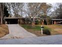 Brick ranch home with long driveway and mailbox at 2499 Little John Se Trl, Marietta, GA 30067