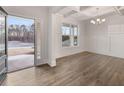 Bright dining room with hardwood floors, large windows, and white wainscoting at 42 Parkview Dr, Dallas, GA 30157