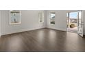 Bright living room with hardwood floors and view to the front yard at 88 Parkview Dr, Dallas, GA 30157