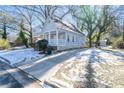 Light gray house with a front porch and driveway at 1156 Tucker Sw Pl, Atlanta, GA 30310