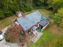 Property showing house with roof damage at 1345 Gun Club Nw Rd, Atlanta, GA 30318