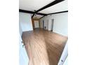 Living room with hardwood floors and wood beams at 6354 Shannon Pkwy # 27D, Union City, GA 30291