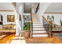 Grand entryway with a sweeping staircase and hardwood floors at 4685 Jailette Trce, Atlanta, GA 30349